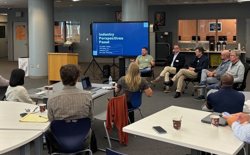 Photo of attendees listening to presenters at a PA Summit training