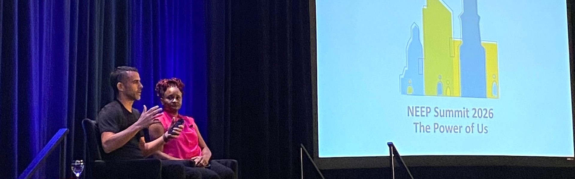Two panelists sitting on stage