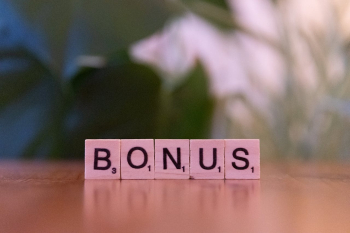 ""Scrabble tiles spelling the word "bonus"